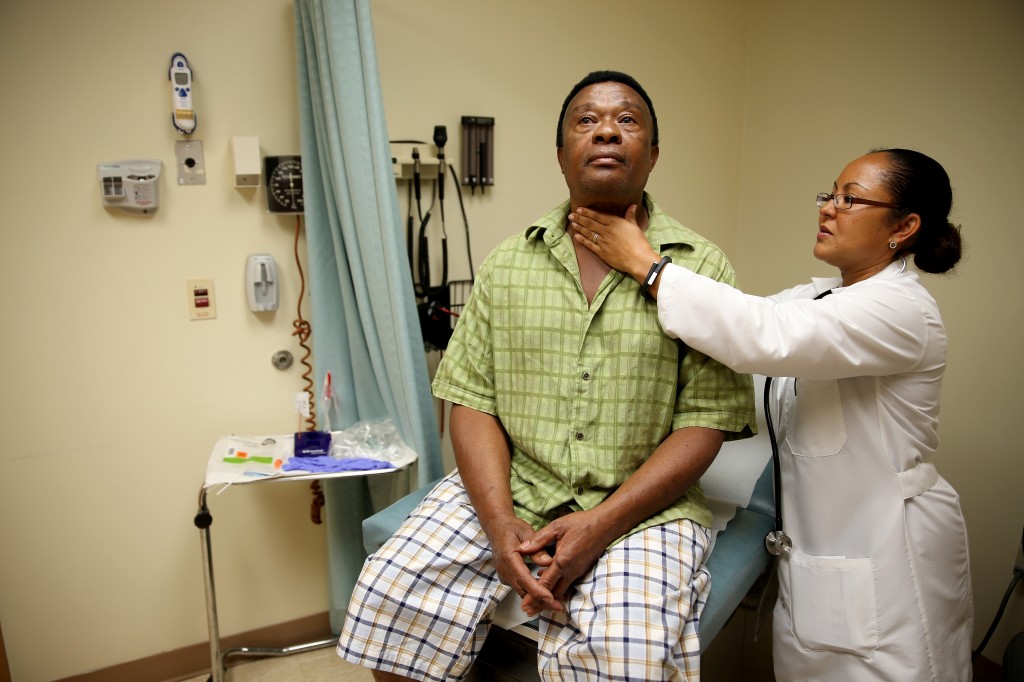 A newly insured patient through the Affordable Care Act receives a checkup April 15 in Hollywood, Florida. Photo by Joe Ra...