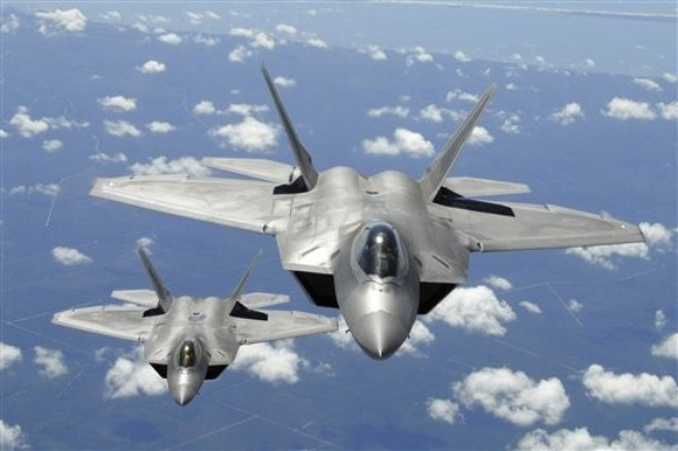 ** FILE ** In this April 2, 2007 file image provided by the US Air Force, two U.S. Air Force F-22 Raptor aircraft flying i...