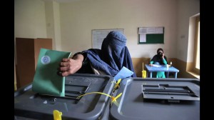 An Afghan woman casts her vote at a polling station in Jalalabad east of Kabul, Afghanistan, Saturday, April 5, 2014