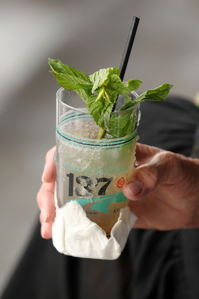 An observer drinks a mint julep during the 137th Kentucky Derby at Churchill Downs on May 7, 2011.  Each year, around 120,000 mint juleps are served at Churchill Downs over a two-day period.(Photo by Al Bello/Getty Images) The mint julep has been promoted by Churchill Downs in association with the Kentucky Derby since 1938. Each year almost 120,000 juleps are served at Churchill Downs over the two-day period of the Kentucky Oaks and the Kentucky Derby, virtually all of them in specially made Kentucky Derby collectible glasses.[7]