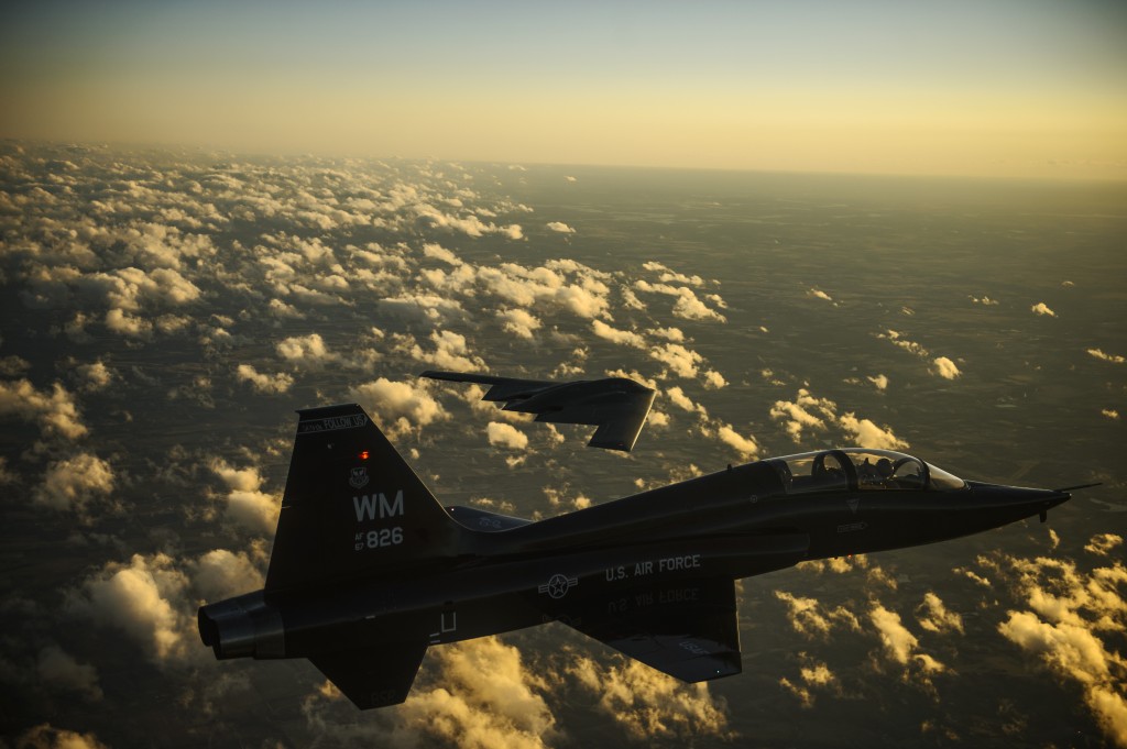 A U.S. Air Force T-38 Talon and B-2 Spirit fly in formation during a training mission Feb. 20, 2014. The B-2 is a multi-role bomber capable of delivering both conventional and nuclear ammunition. Department of Defense photo by Staff Sgt. Jonathan Snyder, U.S. Air Force 