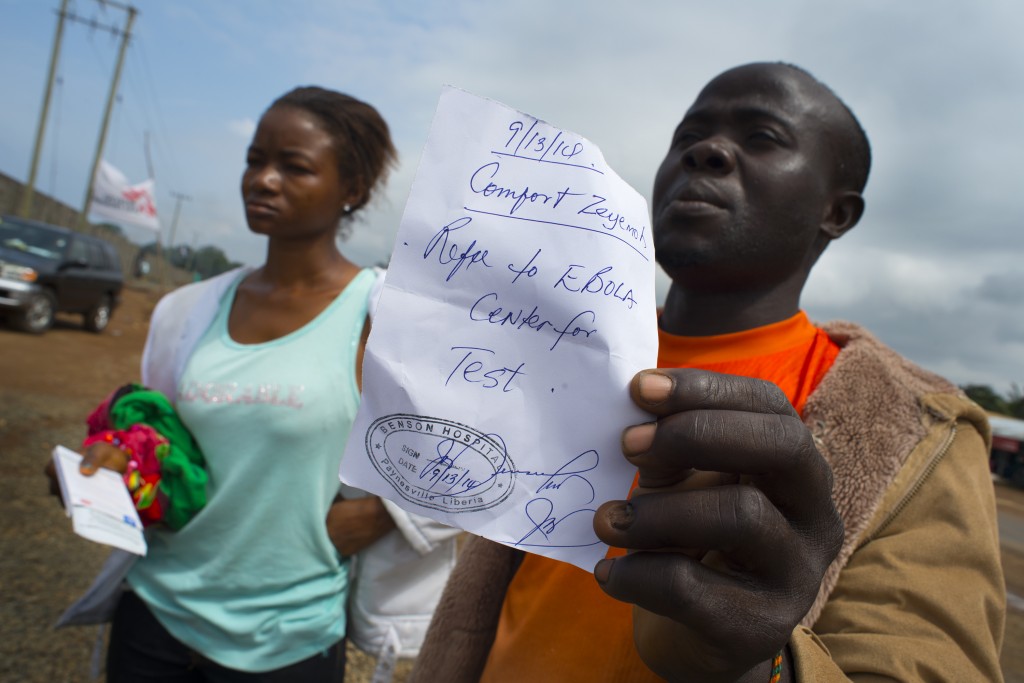 A man in Monrovia, Liberia, shows a doctor's order to get tested for the Ebola virus. Photo by Michel du Cille/The Washington Post via Getty Images