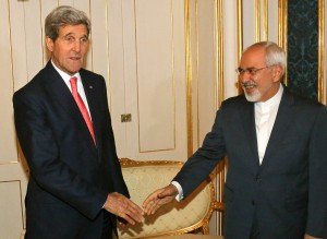 US Secretary of State John Kerry (L) and Iranian Foreign Minister Mohammad Javad Zarif shake hands prior to a bilateral meeting of the closed-door nuclear talks with Iran at the Palais Coburg in Vienna on November 23, 2014.Iran and world powers engaged Sunday in a last-ditch diplomatic blitz to nail down a nuclear deal in less than 36 hours, with Tehran signalling it is open to extending talks by up to a year. AFP PHOTO / POOL/ RONALD ZAK (Photo credit should read RONALD ZAK/AFP/Getty Images)