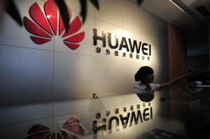 A receptionist sits behind the counter at the Huawei office in Wuhan, central China's Hubei province in 2012. Photo by STR/AFP/GettyImages