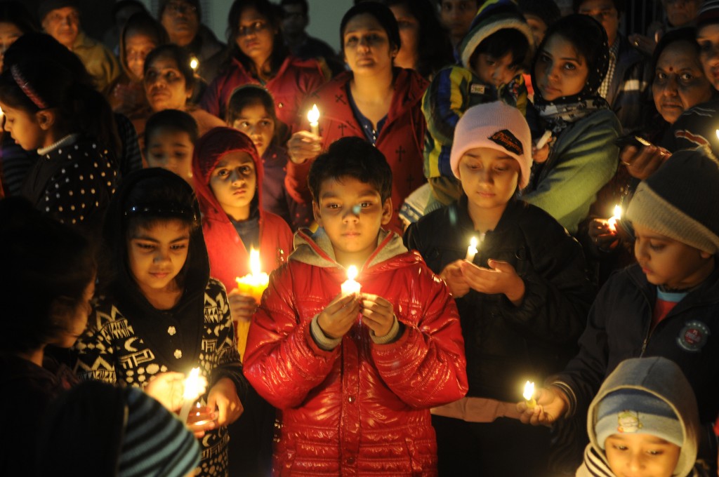 Children and their parents in Noida, India, light candles for the victims of the Taliban attack on the school in Peshawar, Pakistan, on Dec. 17. Photo by Burhaan Kinu/Hindustan Times via Getty Images