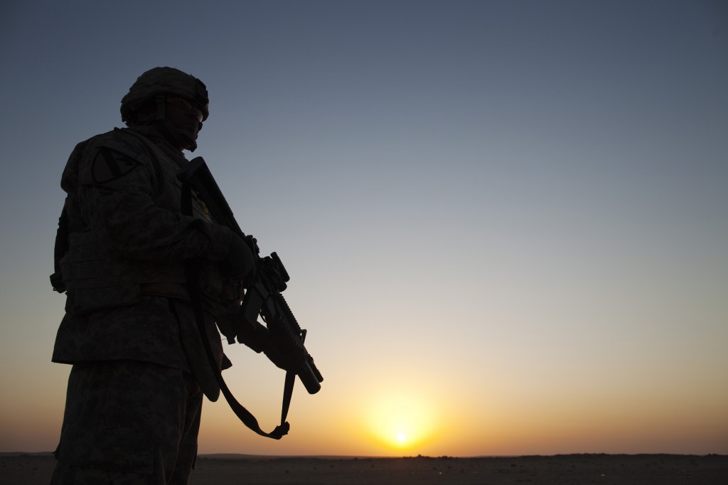 U.S. Specialist Dante Battle from the 3rd Brigade Combat Team, 1st Cavalry Division secures the perimeter outside of a Min...