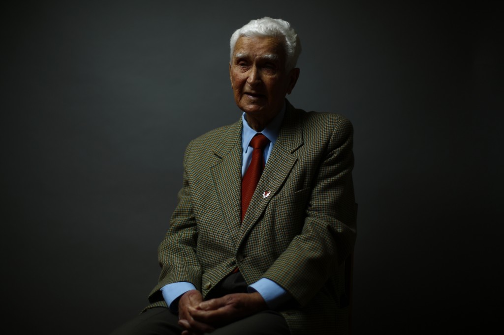 Auschwitz concentration camp survivor Henryk Duszyk poses for a portrait in Warsaw