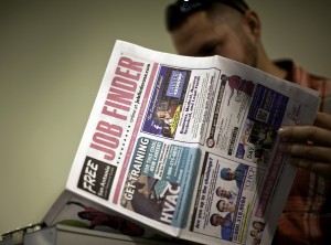 A job seeker reviews listings in the Job Finder at the Rigzone Oil & Gas Career Fair in San Antonio, Texas, U.S., on Tuesday, Oct, 23, 2012. The U.S. Department of Labor is scheduled to release initial jobless claims figures on Oct. 25. Photographer: Eddie Seal/Bloomberg via Getty Images