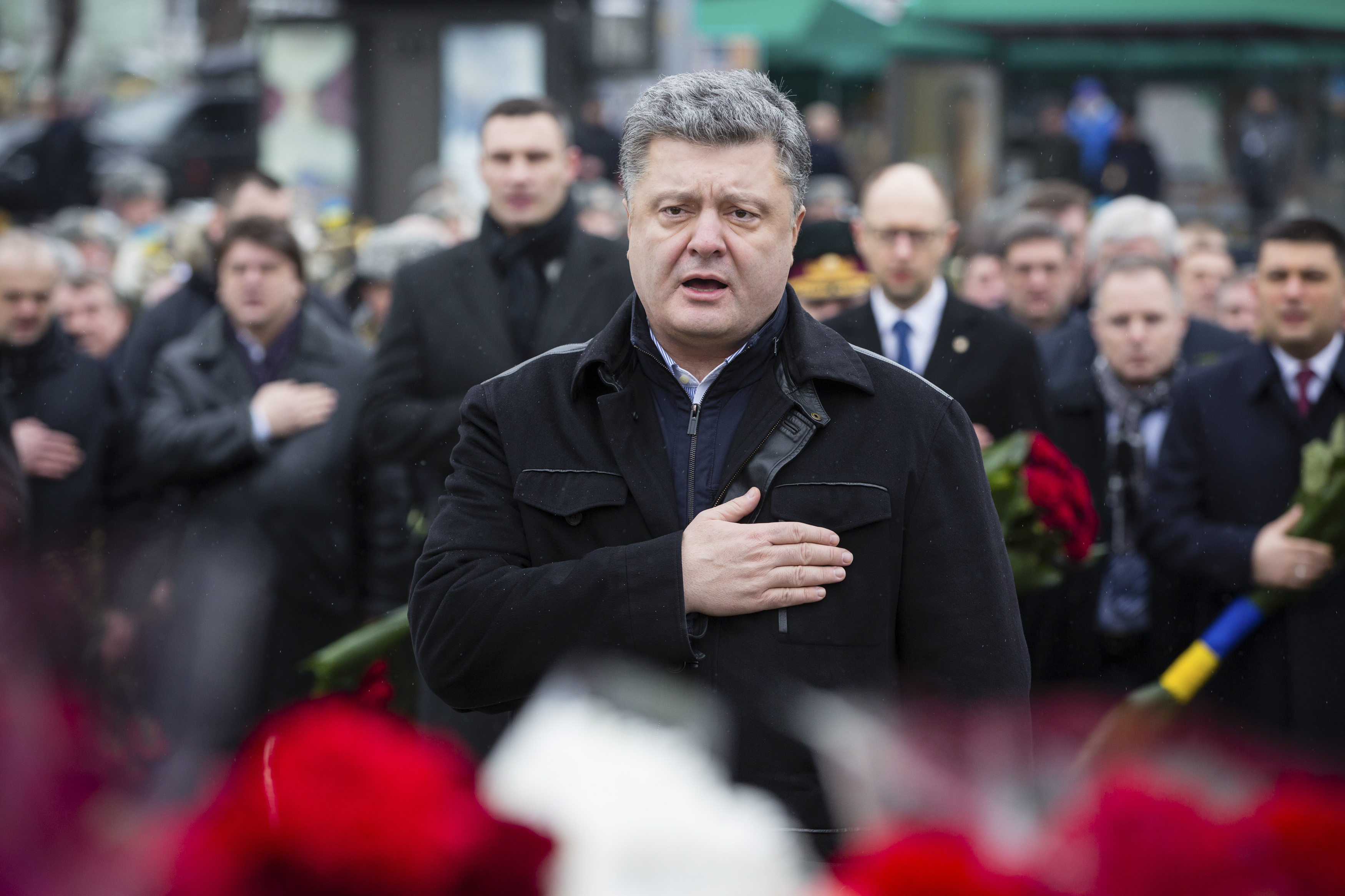 Ukrainian President Petro Poroshenko takes part in a wreath laying ceremony near a Kiev monument to servicemen killed during the Soviet military campaign in Afghanistan, February 15, 2015. Photo by Ukrainian Presidential Press Service/Reuters
