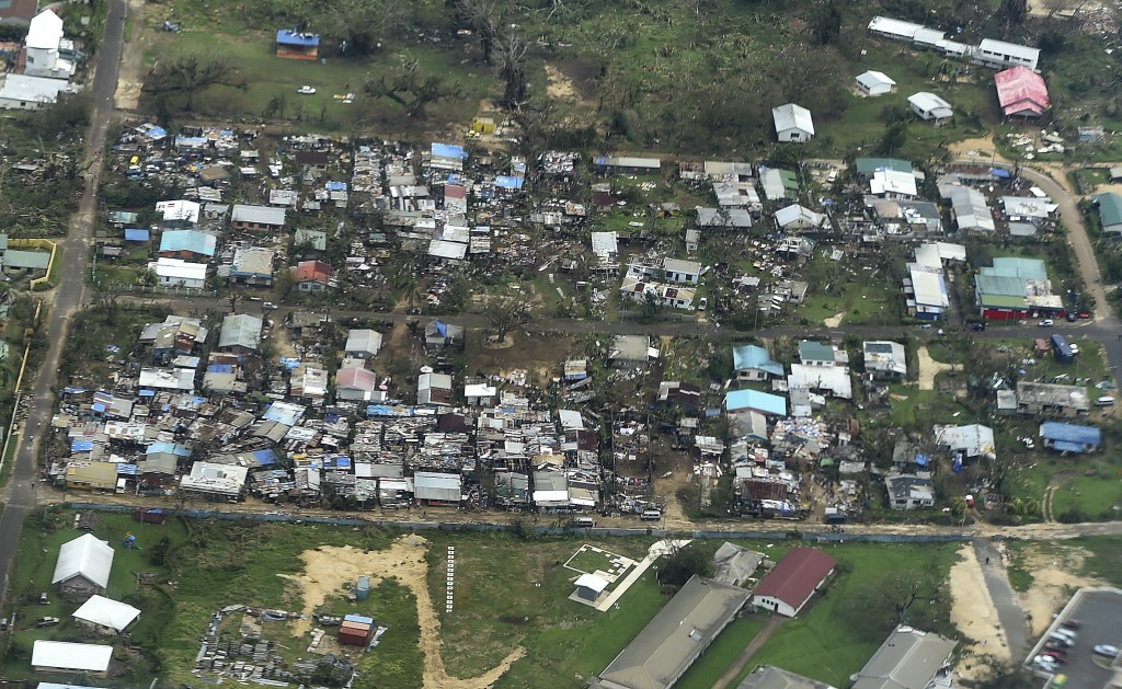 An aerial view on March 16, 2015, shows homes destroyed by Cyclone Pam in Port Vila, the capital of the Pacific island nation of Vanuatu. Photo by Dave Hunt/Pool/Reuters