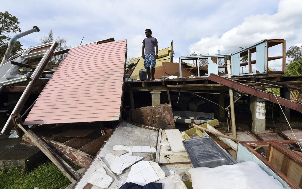 Local resident Adrian Banga stands in the remains of his home destroyed by Cyclone Pam in Port Vila, Vanuatu, in the South Pacific Ocean on March 16, 2015. Photo by Dave Hunt/Pool/Reuters