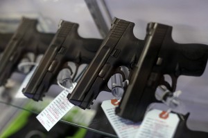 Handguns are seen for sale in a display case at Metro Shooting Supplies in Bridgeton, Missouri, November 13, 2014. The store has reported an increase in gun sales as the area waits for a grand jury to reach a decision this month on whether to indict Darren Wilson, the white police officer who shot and killed the 18-year-old Mike Brown, who was black, on Aug. 9 in the St. Louis suburb of Ferguson. Photo by Jim Young/Reuters