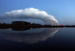 Steam billows from the cooling towers of a coal power station in eastern Germany, Dec. 2, 2009. Administration officials said Sunday that President Barack Obama will impose even steeper cuts on greenhouse gas emissions from U.S. power plants than previously expected. Photo by Pawel Kopczynski/Reuters