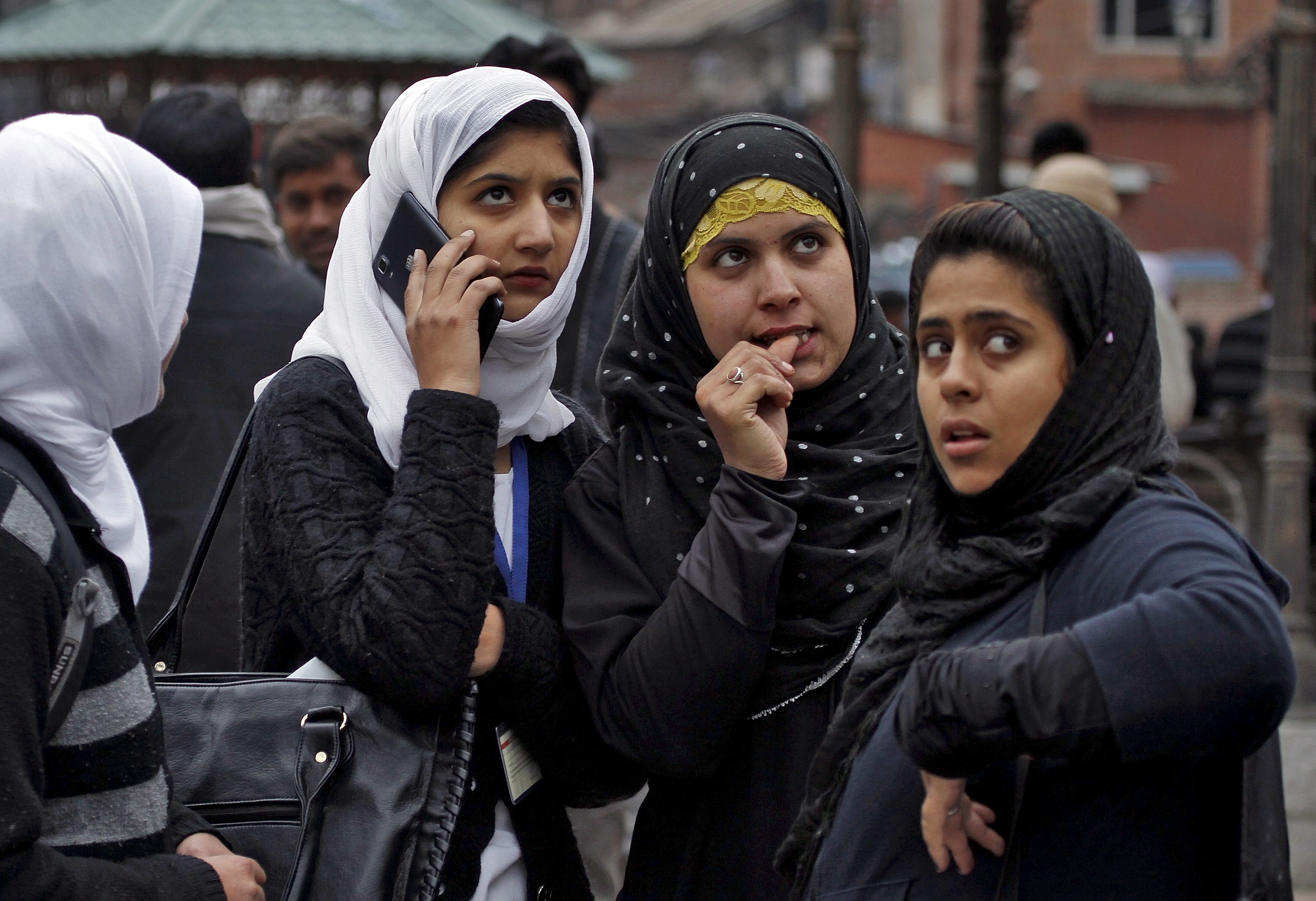 Kashmiri women stand outside a building they vacated following tremors felt in Srinagar on Oct. 26. A 7.5-magnitude earthquake struck in northeastern Afghanistan on Monday, the U.S. Geological Survey said, sending tremors to India and Pakistan. Photo by Danish Ismail/Reuters