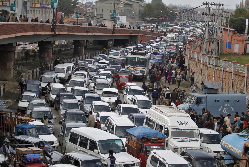 Vehicles jam the road after an overpass was briefly closed to vehicular traffic for precautionary measures following an earthquake in Srinagar in the Indian-administered portion of Kashmir on Oct. 26. A powerful earthquake struck a remote area of northeastern Afghanistan on Monday, shaking the capital Kabul and sending shockwaves to northern India and Pakistan. Photo by Danish Ismail/Reuters