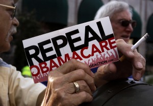 A small group of demonstrators protest against the Affordable Healthcare Act in 2013 in Indianapolis. Photo By Nate Chute/Reuters.