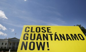 A sign calling for the closure of the U.S.-run Guantanamo Bay prison in Cuba is seen on May 2014 at a rally next to the White House in Washington. Photo By Larry Downing/Reuters   