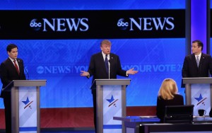 The latest: Candidates spar during GOP debate in New Hampshire