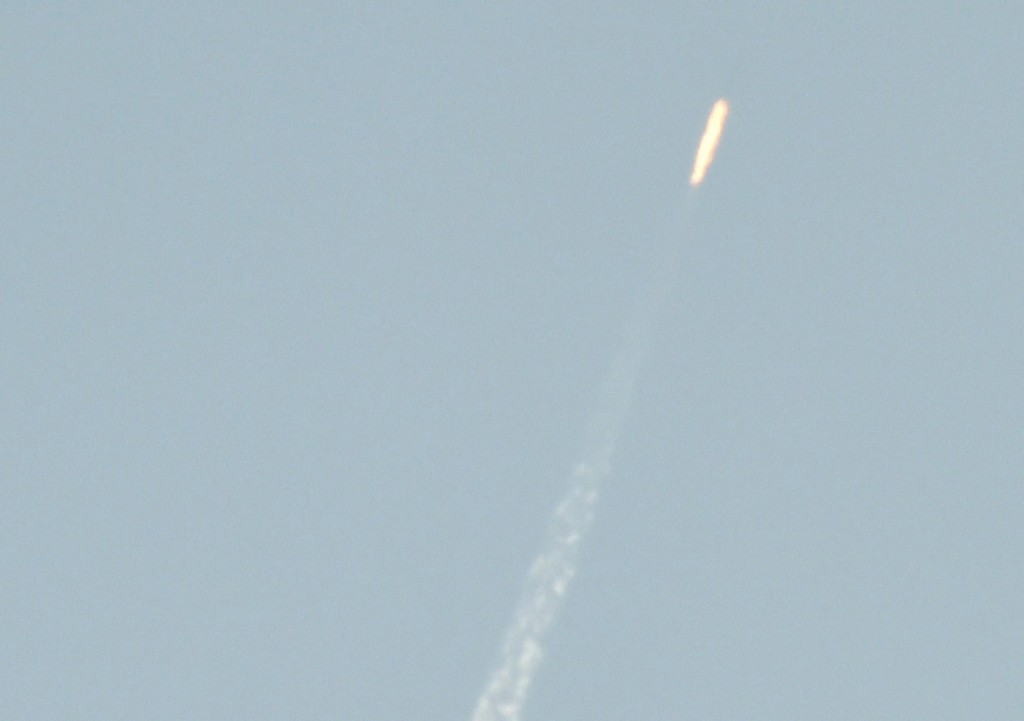 A flying object soars into the air above North Korean territory as seen from the Chinese border city of Dandong, in this photo taken by Kyodo February 7, 2016. North Korea launched a long-range rocket on Sunday carrying what it has said is a satellite, South Korea's defense ministry said, in defiance of United Nations sanctions barring it from using ballistic missile technology. Kyodo/Reuters 