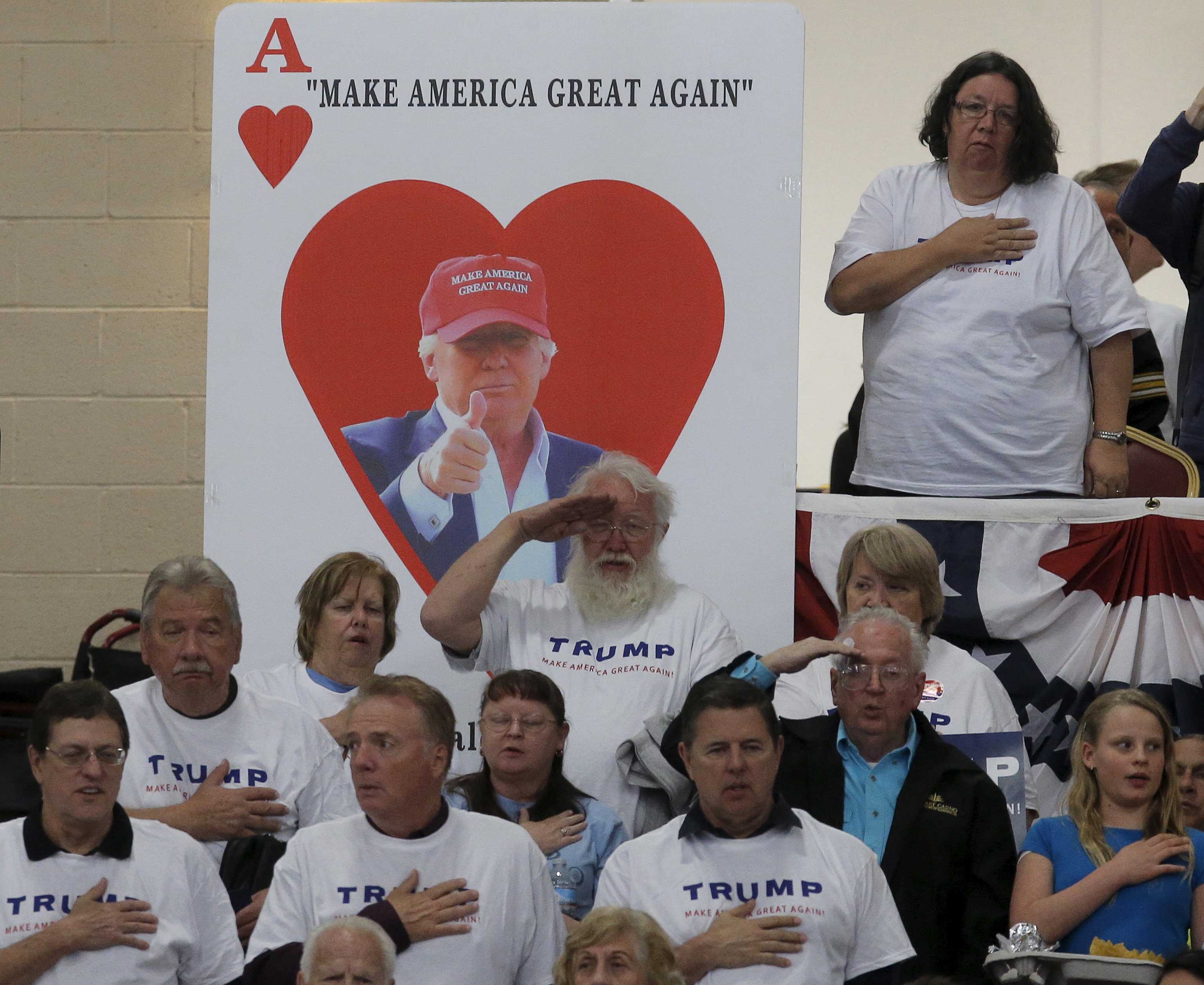 Supporters of U.S. Republican presidential candidate Donald Trump take the Pledge of Allegiance at a campaign rally in Las Vegas, Nevada. Photo by Jim Young?Reuters