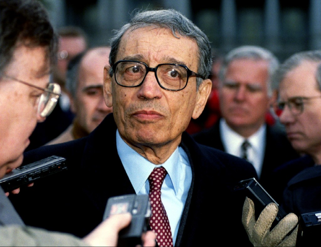 U.N. Secretary-General Boutros Boutros-Ghali is surrounded by reporters as he leaves the White House after meeting with then-President Bill Clinton in this Feb 23, 1993, file photo. Photo by Reuters stringer