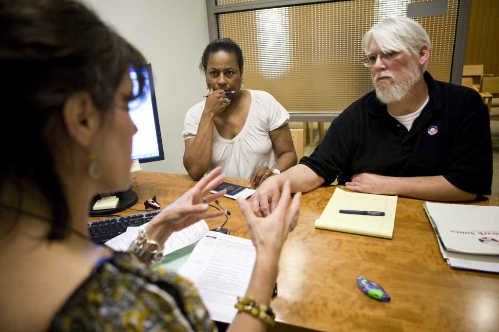 Sherri (C) and Curtis Walker (R) go over retirement options with Calpers Benefit Program Specialist Lisa Bacon (L) at the ...