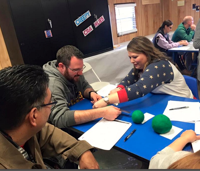 Teachers at SEEC create the solar system out of clay in order to see how large solar bodies are in comparison to each other. Photo by Blanca Gonzales