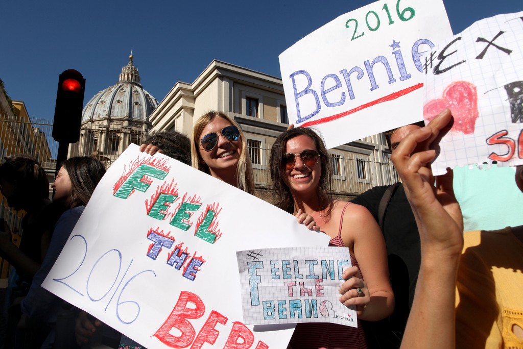 VATICAN CITY, VATICAN - APRIL 15:   Supporters of U.S. Democratic presidential canditate Bernie Sanders hold signs outside the 'Centesimus Annus 25 Years Later Symposiumon' at the Casina Pio IV April 15, 2016 in Vatican City, Vatican. Candidate Bernie Sanders came to Rome to attend a conference sponsored by the Pontifical Academy of Social Sciences marking the 25th anniversary of Pope St. John Paul II's social encyclical 'Centesimus Annus.'  (Photo by Franco Origlia/Getty Images)