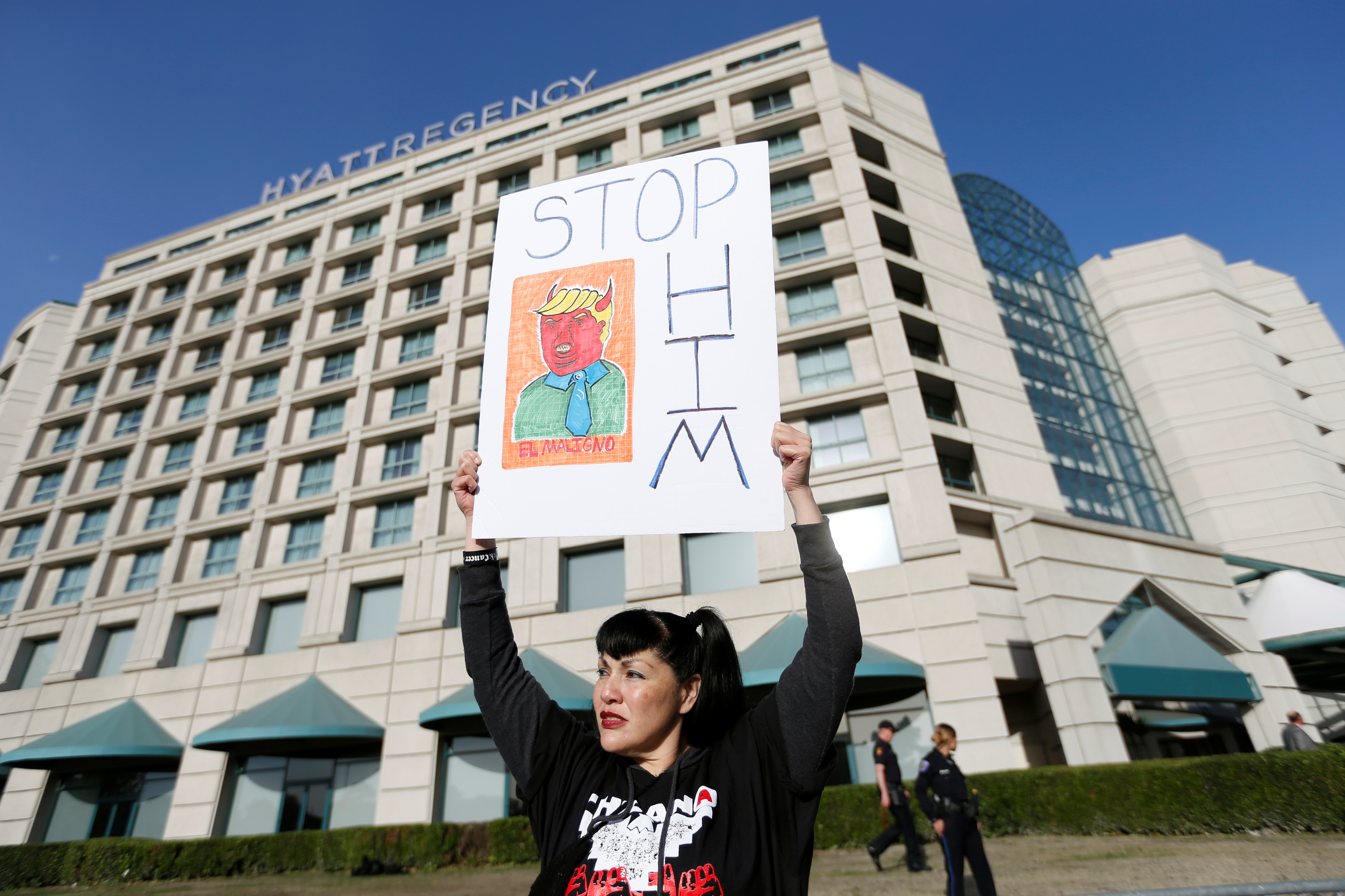 A demonstrator holds a sign in protest of Republican presidential candidate Donald Trump during the California Republican convention in Burlingame, California. Photo by Stephen Lam/Reuters