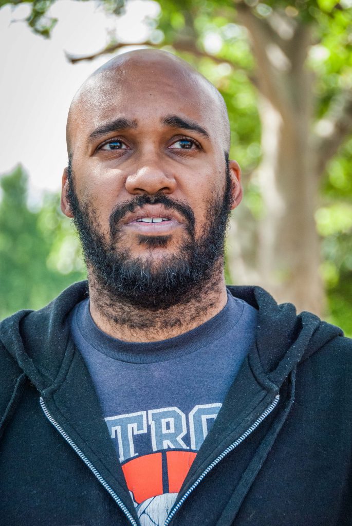 Aaron Foley, author of "How To Live In Detroit Without Being A Jackass" in Clark Park, Detroit. 
