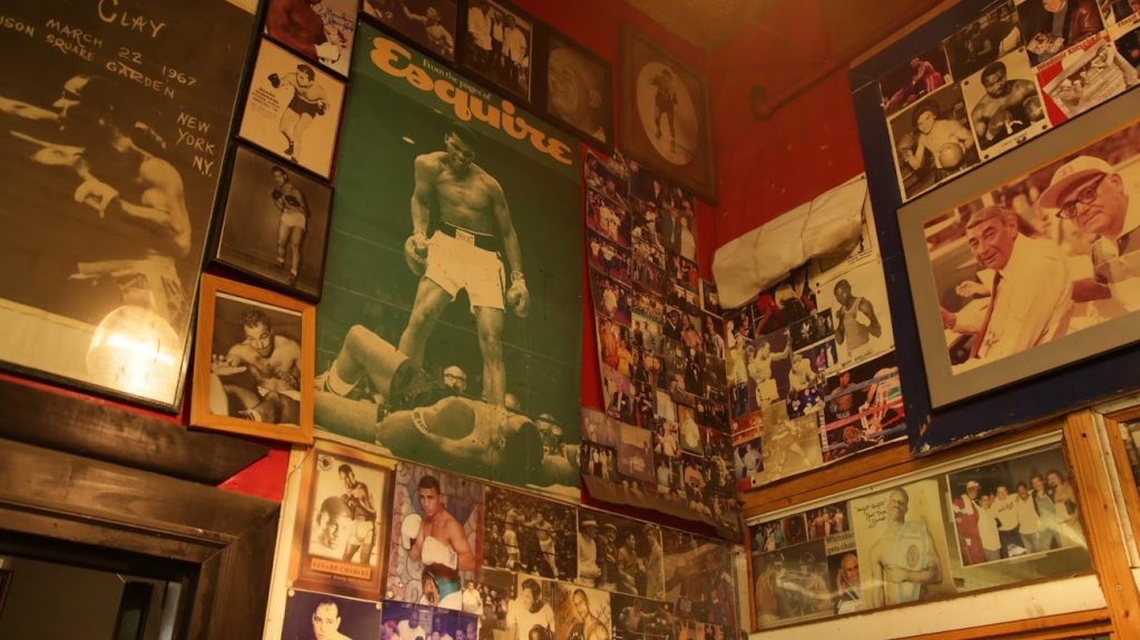 Posters hang at Gleason's Gym in Brooklyn, NY. Photo by Andi Wang/NewsHour Weekend