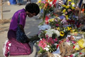 Patricia Bailey prays at a makeshift memorial outside the Emanuel African Methodist Episcopal Church in Charleston