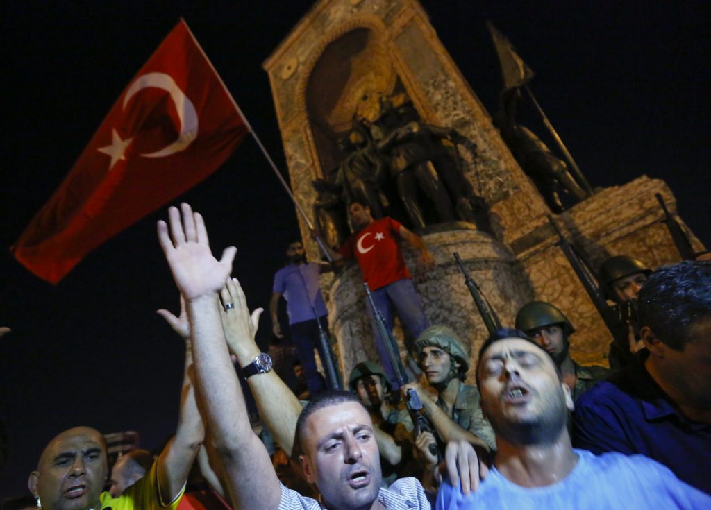 People demonstrate in front of the Republic Monument at the Taksim Square in Istanbul, July 16, 2016.   Photo by REUTERS/Murad Sezer