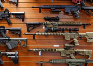 Firearms are shown for sale at the AO Sword gun store in El Cajon, California, January 5, 2016. President Barack Obama said on Monday his new executive actions to tighten gun rules were "well within" his legal authority and consistent with the U.S. right to bear arms, a warning to opponents who are likely to challenge them in court. REUTERS/Mike Blake - RTX2167B