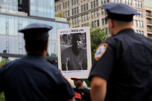 Police observe a 2016 protest in Baltimore over the death of Freddie Gray while he was in police custody. Photo by Andrew Kelly/Reuters