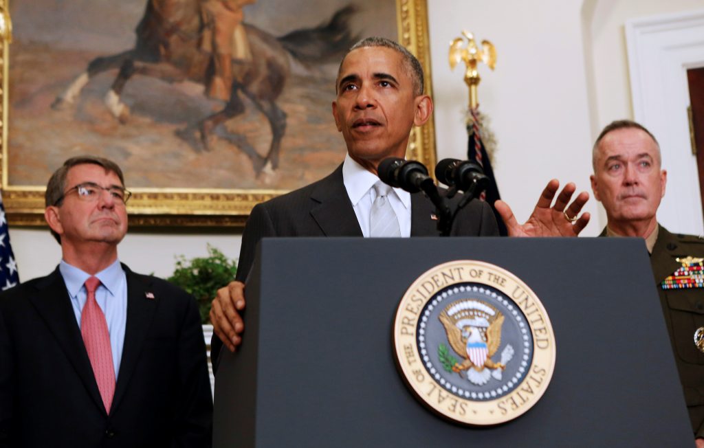 President Barack Obama, surrounded by Secretary of Defense Ash Carter (left) and the Chairman of the Joint Chiefs of Staff USMC Gen. Joseph Dunford Jr. (right), delivers a statement from the White House on Afghanistan on July 6. Photo by Gary Cameron/Reuters