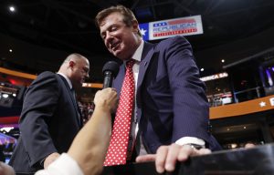 Republican U.S. presidential candidate Donald Trump's campaign manager Paul Manafort talks to the media from the Trump family box on the floor of the Republican National Convention in Cleveland, Ohio, U.S. July 18, 2016. REUTERS/Jonathan Ernst - RTSIMJC