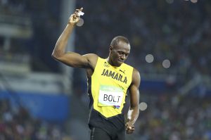 2016 Rio Olympics - Athletics - Final - Men's 200m Final - Olympic Stadium - Rio de Janeiro, Brazil - 18/08/2016. Usain Bolt (JAM) of Jamaica tears off his number tags from his shorts and throws them to the ground after winning the gold. REUTERS/Lucy Nicholson TPX IMAGES OF THE DAY. FOR EDITORIAL USE ONLY. NOT FOR SALE FOR MARKETING OR ADVERTISING CAMPAIGNS. - RTX2LYCQ