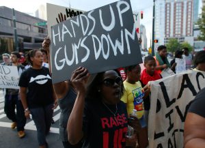 Clinton says wave of shootings show need to protect children