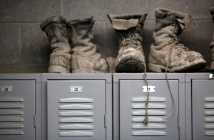 Coal mining boots are shown above miners' lockers before the start of an afternoon shift at a coal mine near Gilbert, West Virginia May 22, 2014. REUTERS/Robert Galbraith/File Photo GLOBAL BUSINESS WEEK AHEAD PACKAGE - SEARCH 'BUSINESS WEEK AHEAD MAY 2' FOR ALL IMAGES - RTX2CDIO