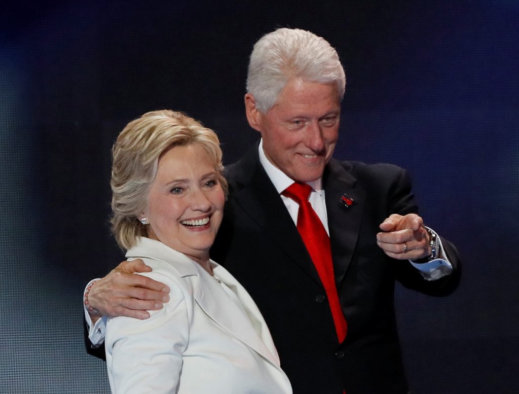 File photo of Democratic presidential nominee Hillary Clinton and her husband, former President Bill Clinton, by Mike Segar/Reuters