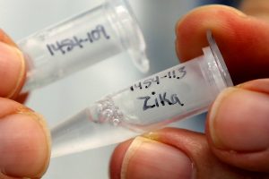 Research scientist Dan Galperin holds vials marked "Zika" at Protein Sciences Inc. where they are working on developing a vaccine for the Zika virus in Meriden