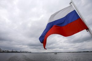 A Russian flag flies over the Volgarive in the town of Nizhny Novgorod, Russia, July 10, 2015. Russia will host the World Cup soccer tournament for FIFA in 2018. REUTERS/Maxim Shemetov - RTX1JXFE