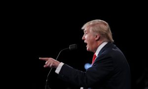 Republican U.S. presidential nominee Donald Trump speaks as Democratic U.S. presidential nominee Hillary Clinton listens during their third and final 2016 presidential campaign debate at UNLV in Las Vegas, Nevada, U.S., October 19, 2016. Photo by Joe Raedle/REUTERS