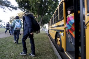 Students exit a bus in Los Angeles. File photo by Jonathan Alcorn/Reuters