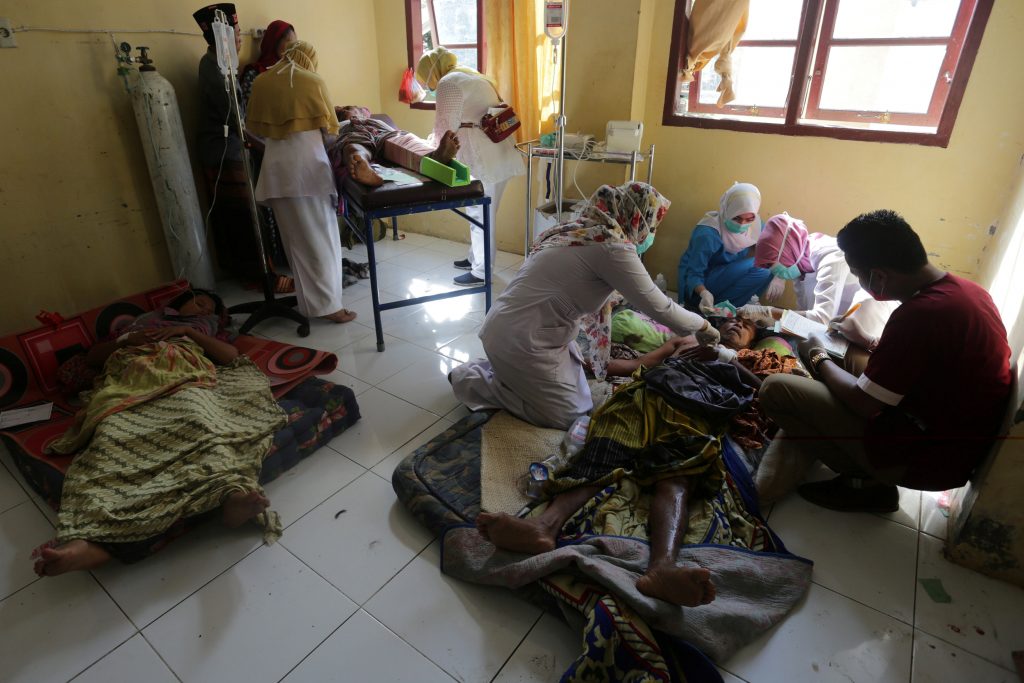 Injured people receive medical attention at a hospital following a Dec. 7 earthquake in Sigli, Pidie regency, in the northern province of Aceh, Indonesia. Antara Foto/Irwansyah Putra/via REUTERS