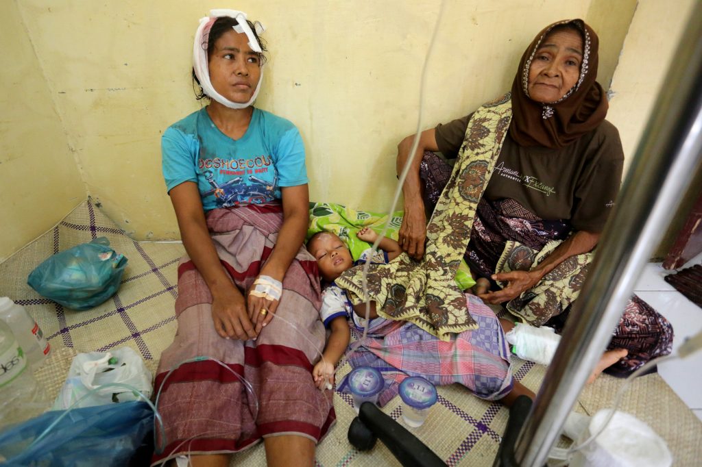 Injured people receive medical attention at a hospital following a Dec. 7 earthquake in Sigli, Pidie regency, in the northern province of Aceh, Indonesia. Antara Foto/Irwansyah Putra/via REUTERS