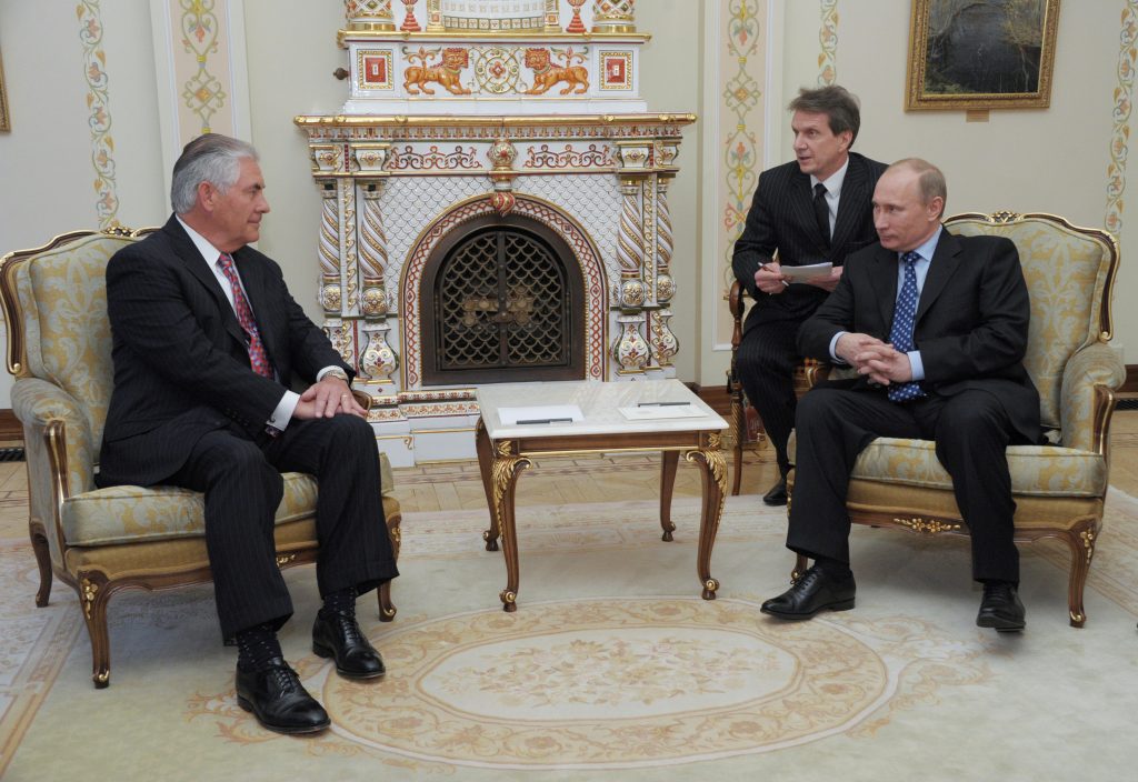 Then Russian Prime Minister Vladimir Putin and Exxon Mobil Chief Executive Rex Tillerson attend a meeting at the Novo-Ogaryovo state residence outside Moscow, Russia April 16, 2012. Picture taken April 16, 2012. Sputnik/Kremlin/Alexei Nikolskyi via REUTERS ATTENTION EDITORS - THIS IMAGE WAS PROVIDED BY A THIRD PARTY. EDITORIAL USE ONLY. - RTX2UTIM