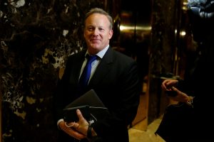hief Strategist &amp; Communications Director for the Republican National Committee Sean Spicer arrives in the lobby of Republican president-elect Donald Trump's Trump Tower in New York, New York, U.S. November 14, 2016. REUTERS/Carlo Allegri/File Photo