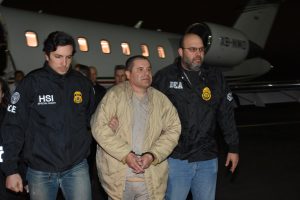 Mexico's top drug lord Joaquin "El Chapo" Guzman is escorted as he arrives at Long Island MacArthur airport in New York, U.S., January 19, 2017, after his extradition from Mexico. Photo courtesy: U.S. officials/Handout via Reuters